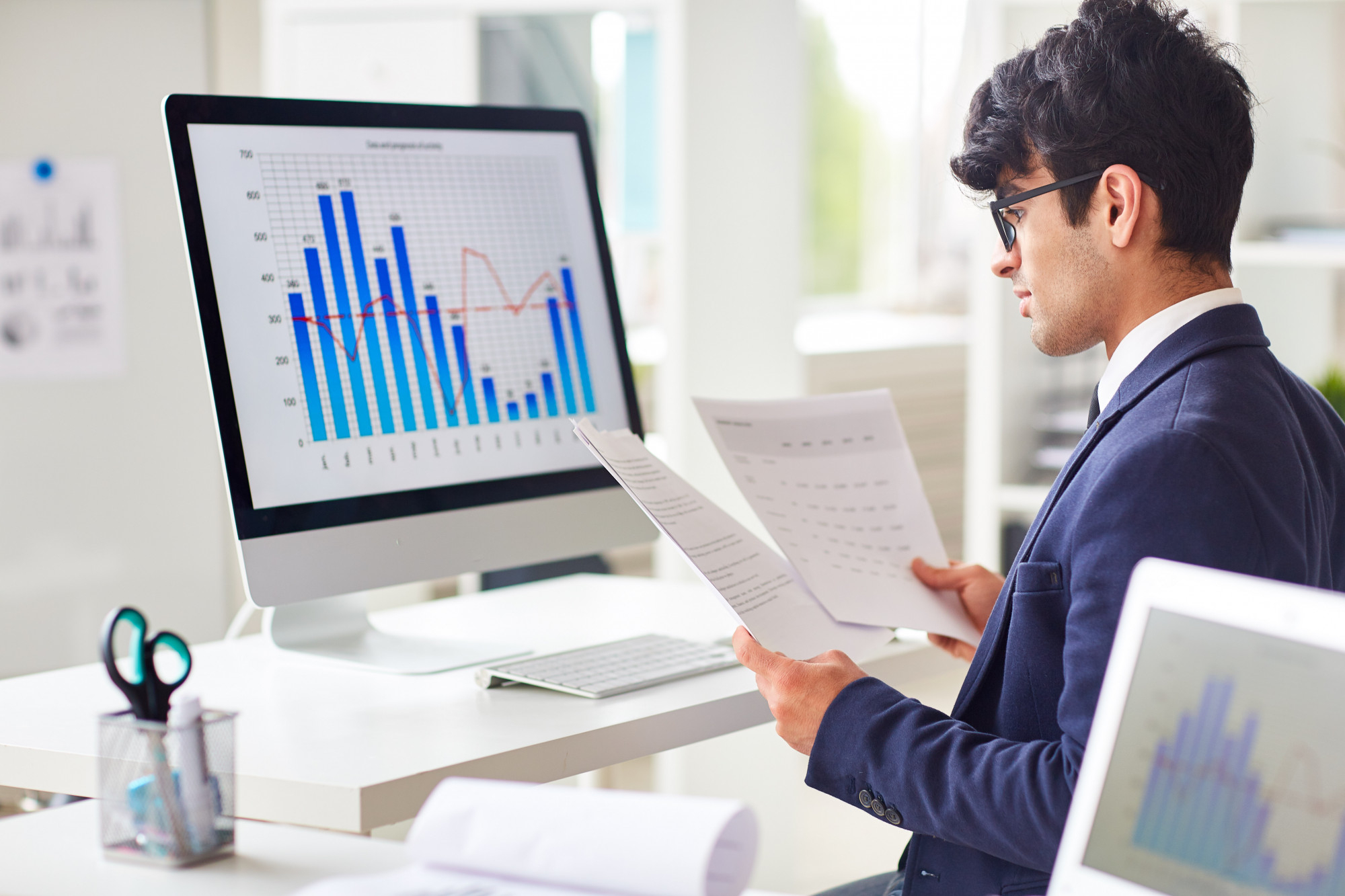 Young man reading the analytics and reports