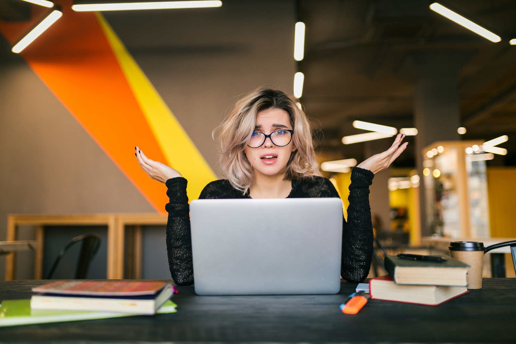 Confused girl in front of a laptop