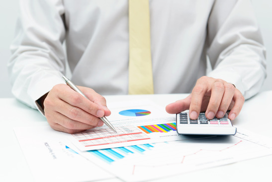 Man Performing Business Calculations
