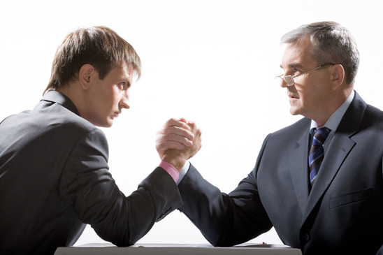 Young Businessman Competing with Older Businessman