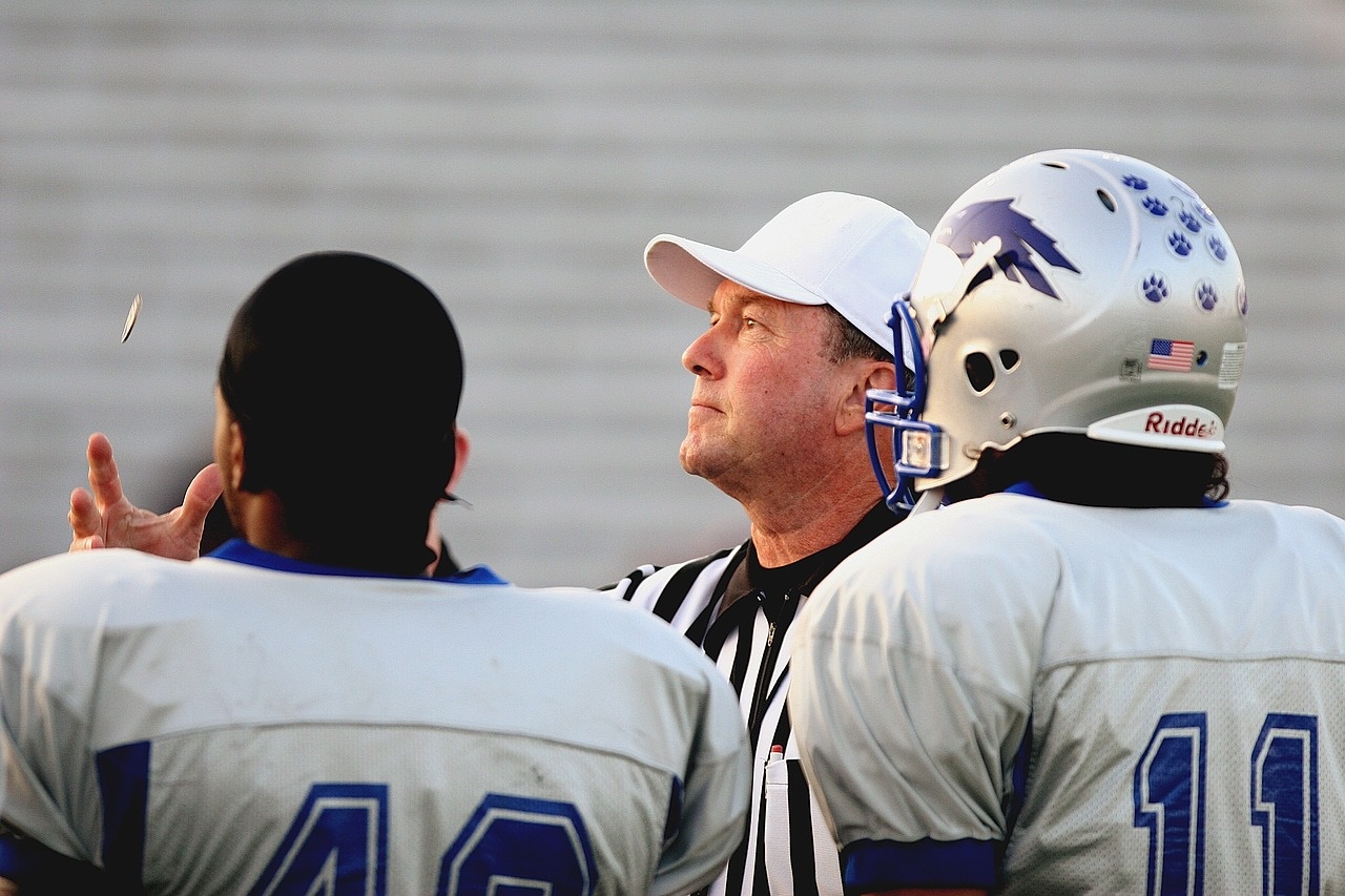 Football Referee Flipping a Coin