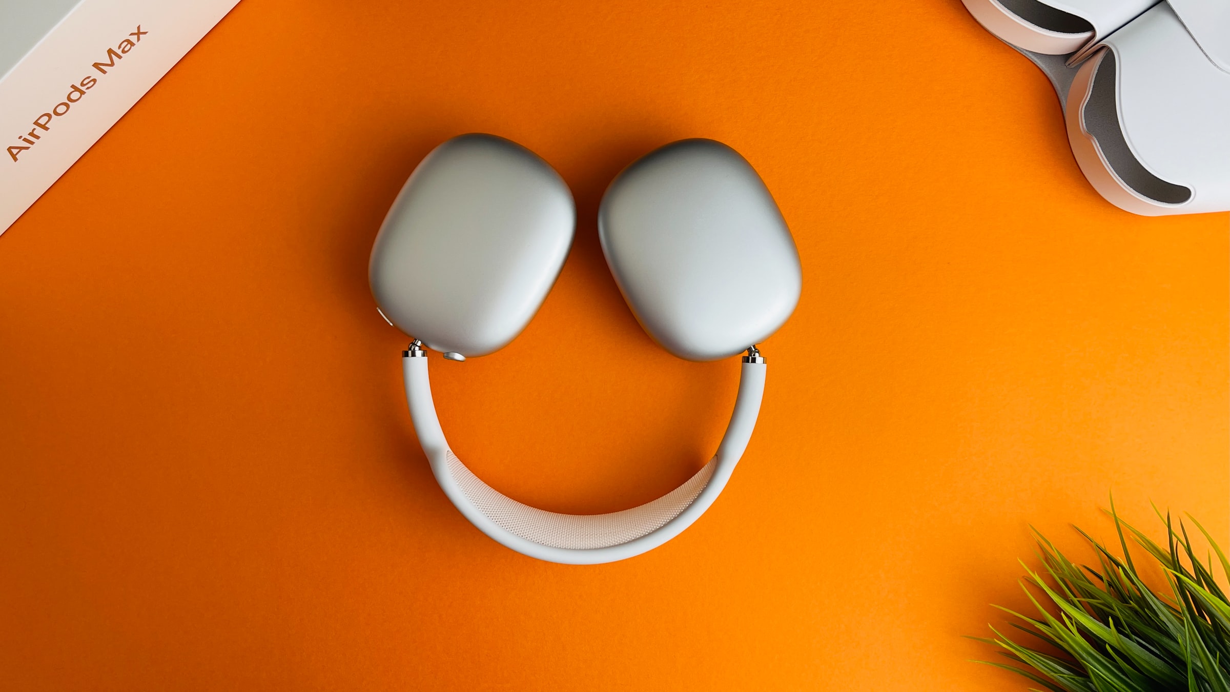 Headphones placed on an orange background