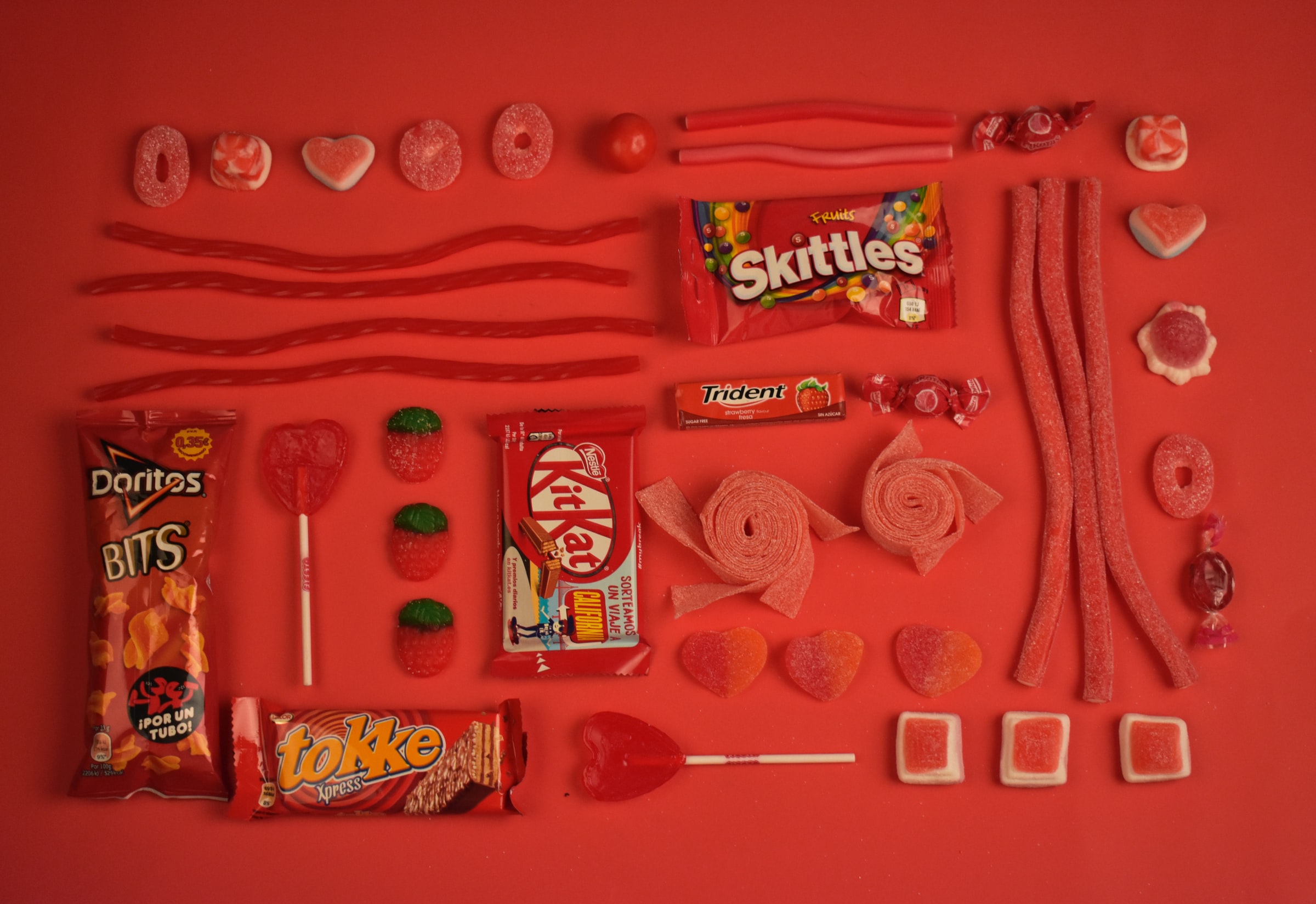 Candies, chocolates and other snacks all with red packaging