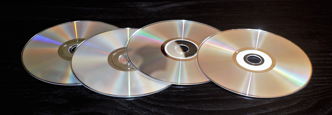 Upside-Down DVDs on a Dark Table