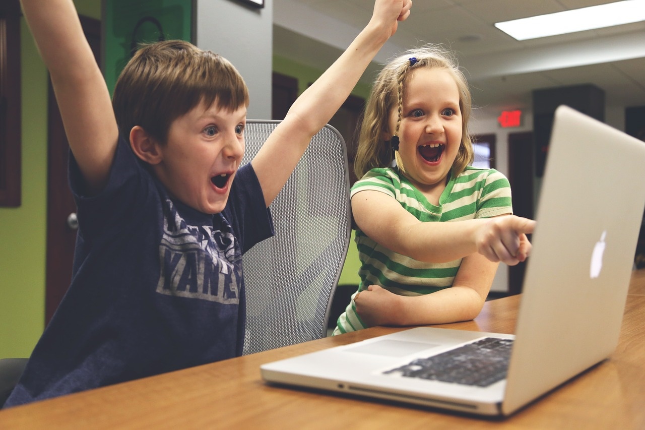 Excited Kids at a Computer