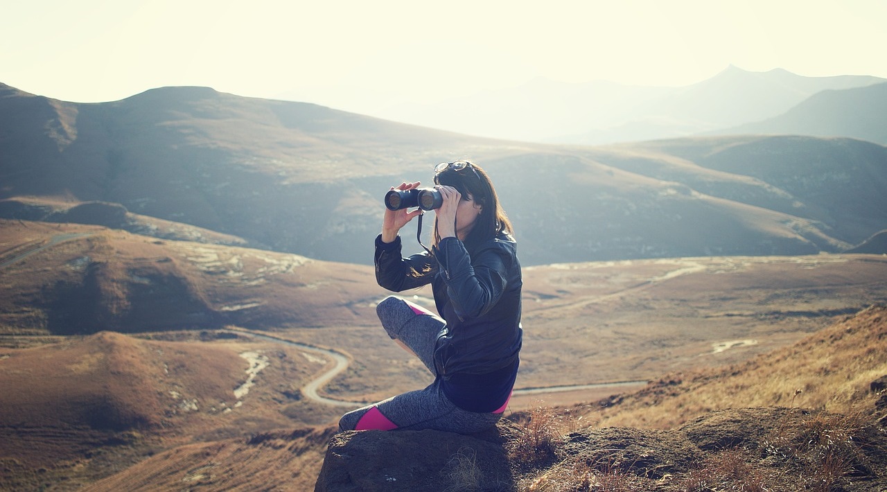 Woman Looking through Binoculars