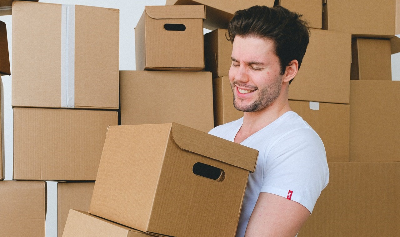 Man carrying cardboard boxes