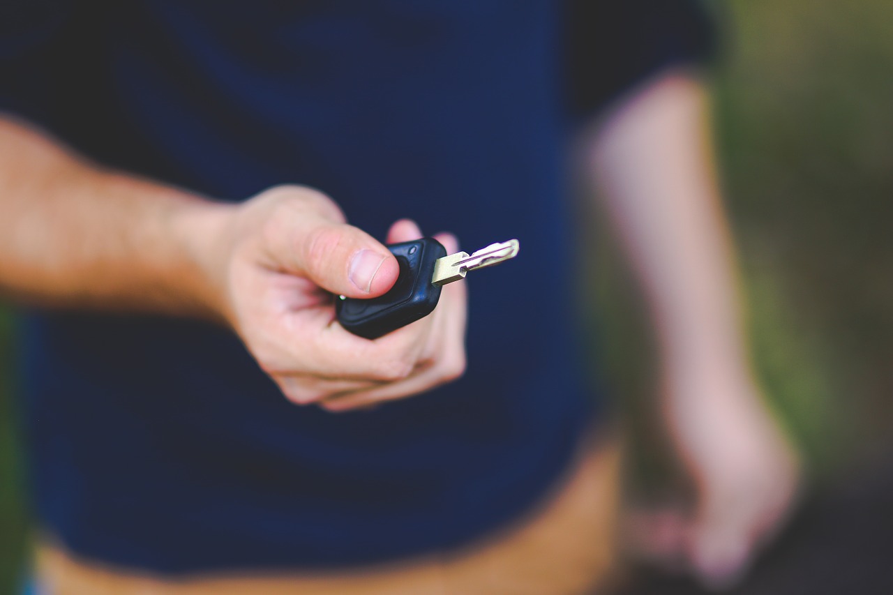 Man Handing a Key to a Valet