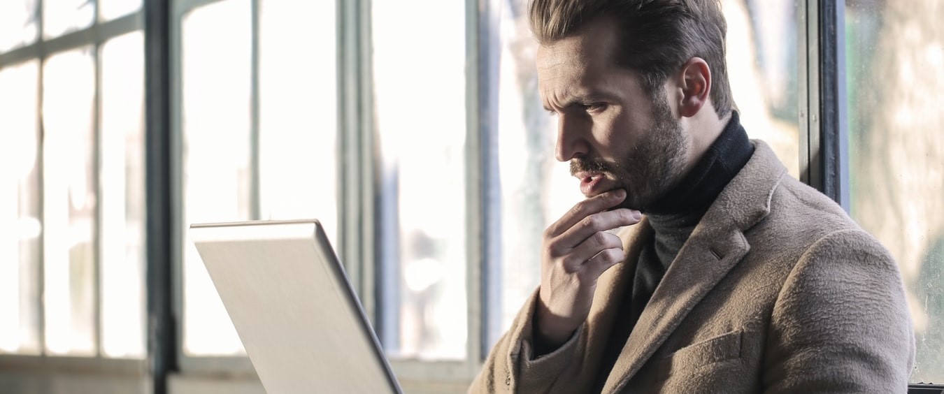 Man looking at laptop screen