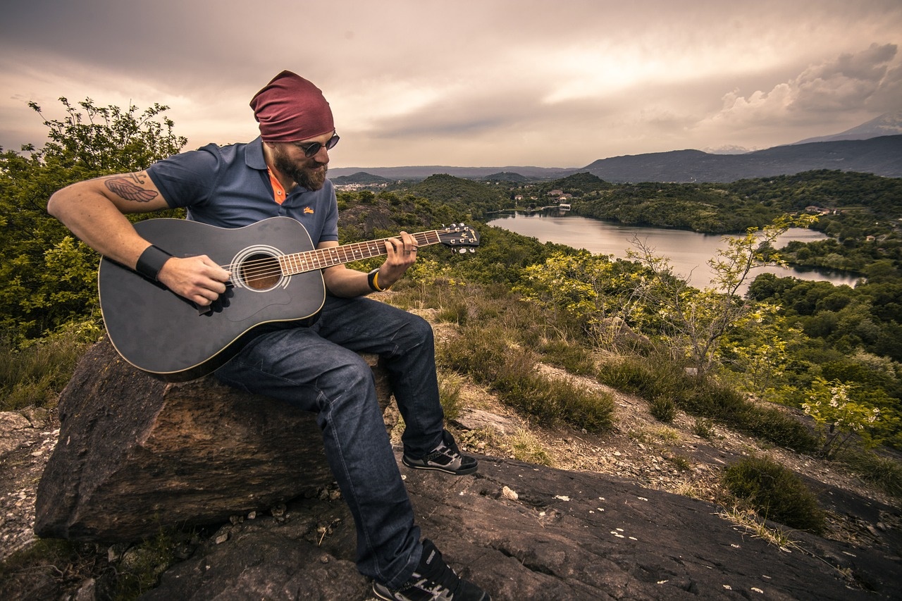 Man Playing Guitar Outdoors