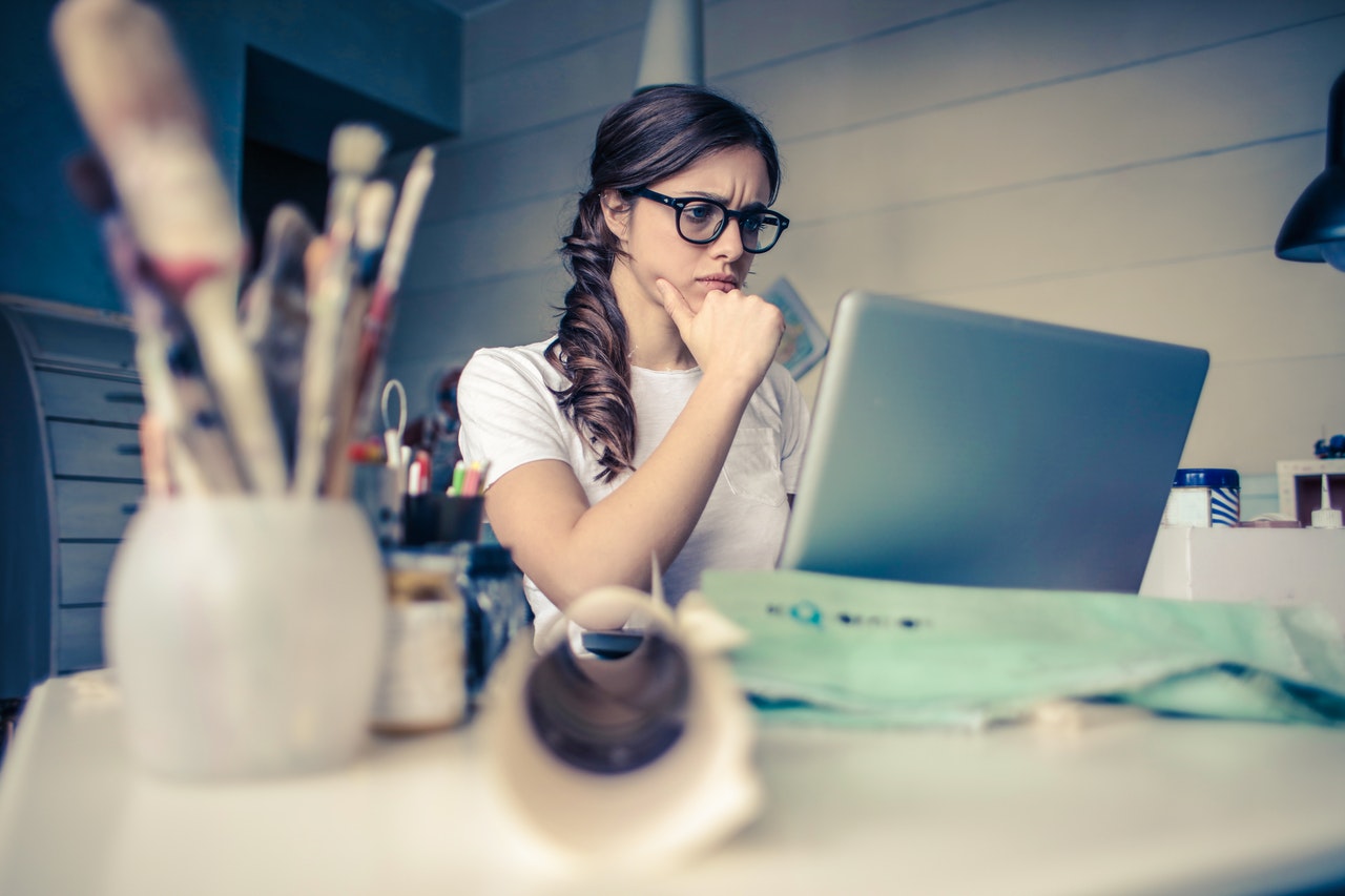 Woman in front of computer doing research