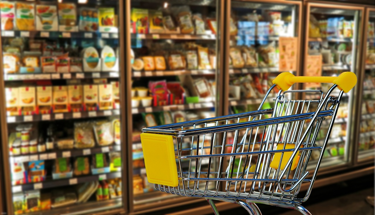 Stocked shelves and shopping cart