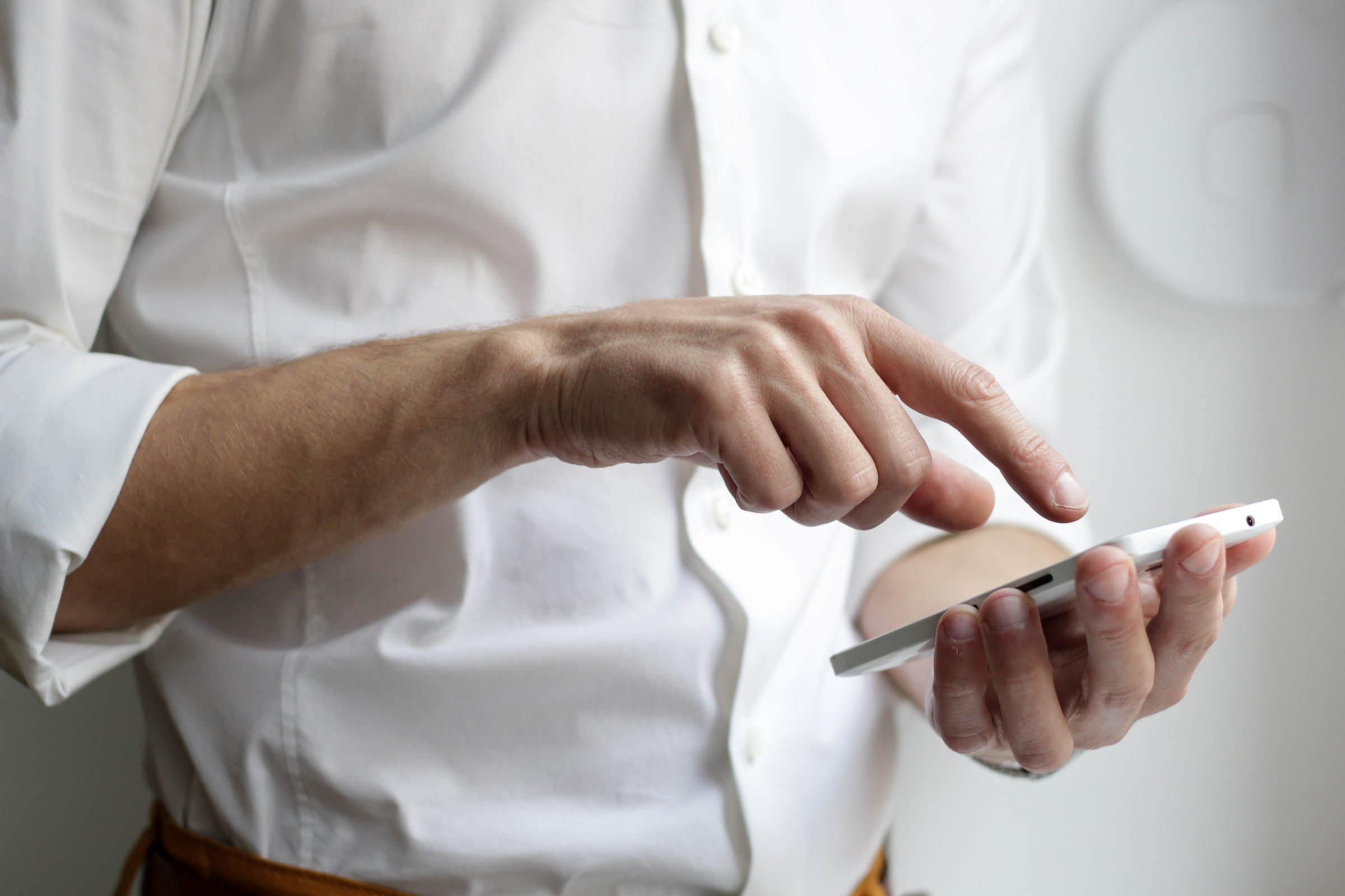 Customer Scrolling through Self-Service Content on His Phone