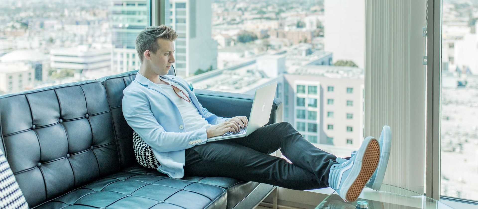 Man using a laptop in couch