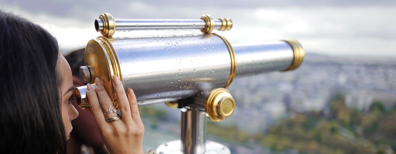 Woman Using a Telescope