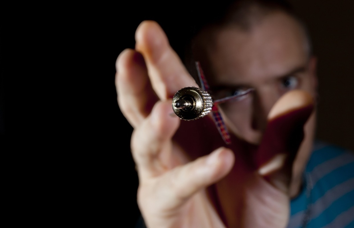 Man Throwing a Dart