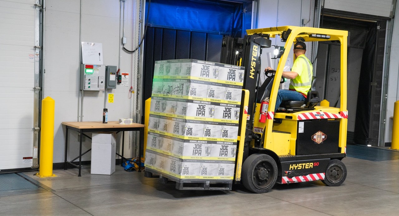 Man driving a forklift in a warehouse