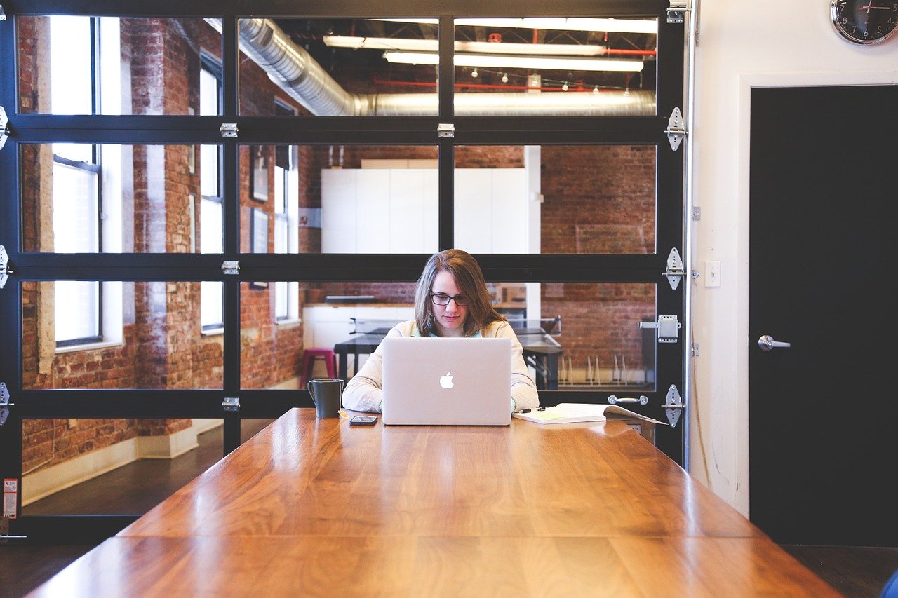 Woman Working Alone in an Empty Office