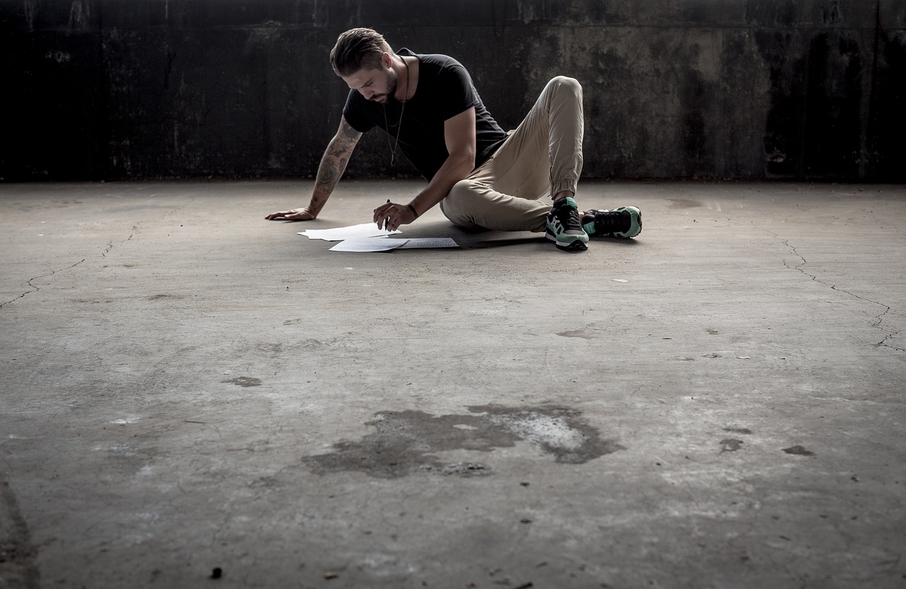 Man on a Concrete Floor, Writing