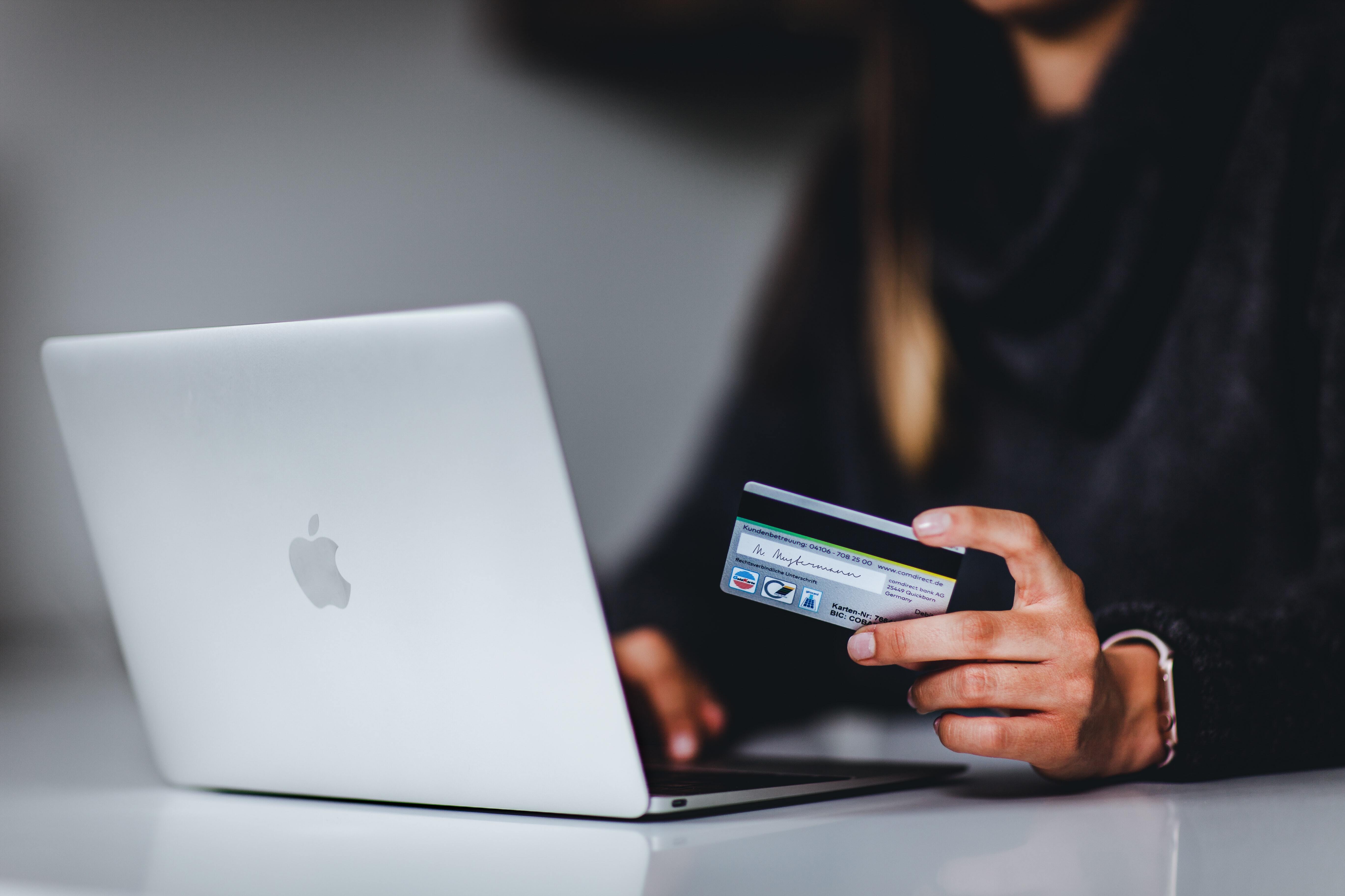 Woman making online purchase with credit card