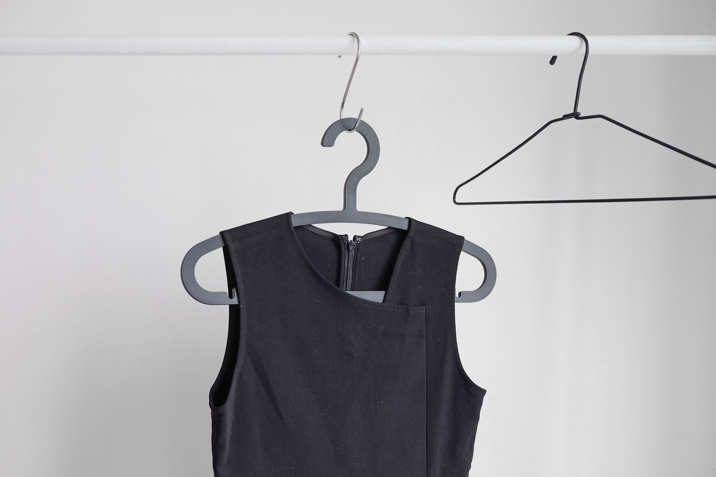 Black sleeveless dress on a hanger
